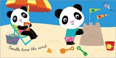 Two cartoon pandas on a beach: one sits under a parasol reading, the other builds a sandcastle. Sand toys and a bucket are nearby. Text reads, “Noodle loves the sand.” A butterfly flies above.